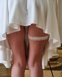 The best angle of long legs under a white dress. photo