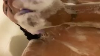 Soaping up my big tits 