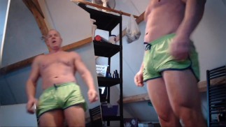 Justin shows his muscles in front of the mirror.