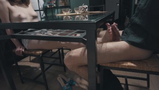 Hot footJob undertable from a petite girl with beautiful boobs