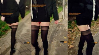 Ragazza con le gambe lunghe, che cammina sexy per strada in pubblico. Puttana Moglie esibizionista in calze