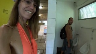 MILF in the public restrooms of a rest area is looking for a daddy to cum in her hot pussy