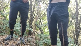 A young guy studies himself in nature
