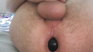Enjoying huge anal bead while edging
