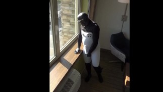 cumming inside wetsuit watching construction workers outside hotel