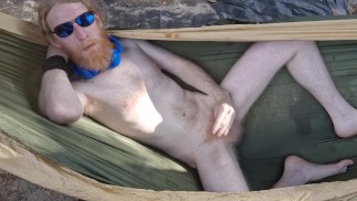 Nudist loses his clothes and cums for you in a hammock