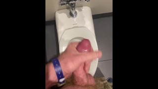 Stroking at the airport bathroom until I shoot 8 big ropes of cum into the toilet.